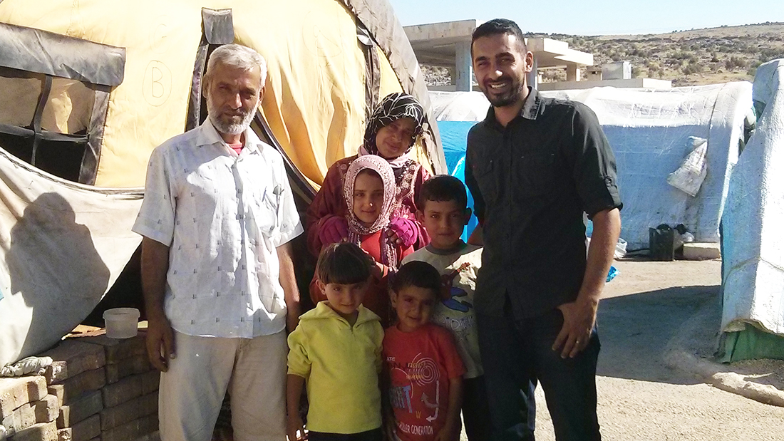 Saleem Al-Nuaimi with a family during a trip to Syria.