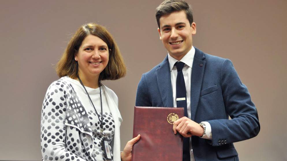 Dr. Anna Oswald receives the Teacher of the Year award from medical student Daniel Skubleny