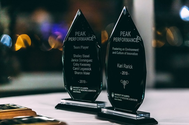 Two PEAK awards on a table
