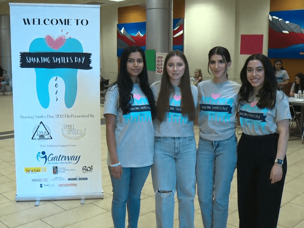 U of A dental students pose at the Sharing Smiles Day event.