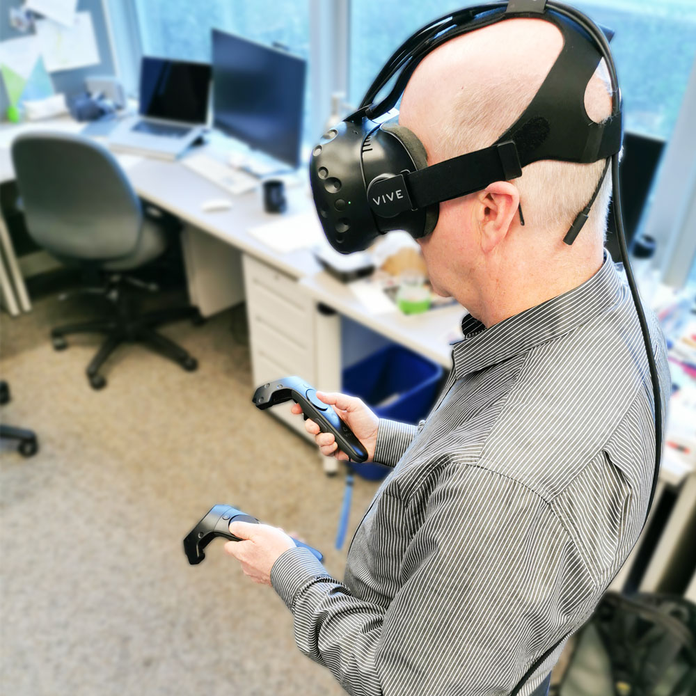Man using a VR headset and controllers