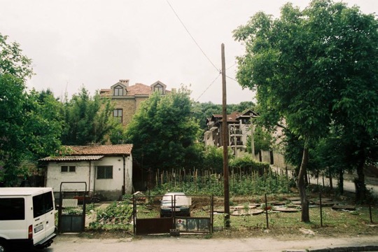 A photograph from Belgrade, with a home in trees on the hillside