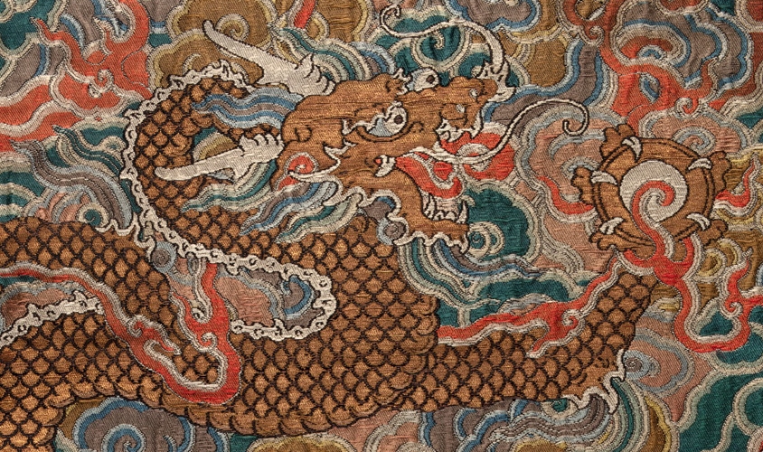 brocade woven gold dragon holding a flaming pearl