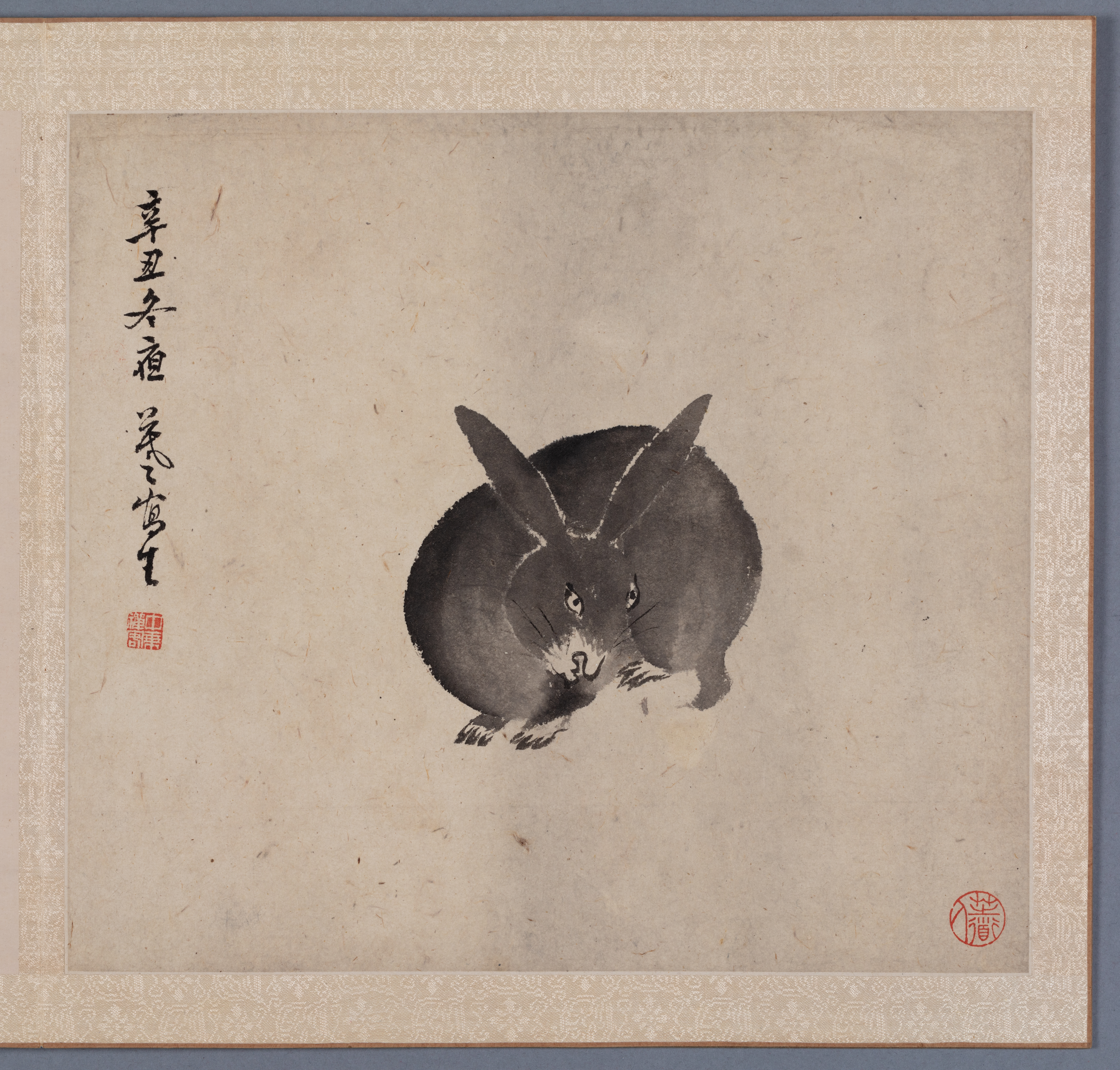 a painted rabbit on an album leaf