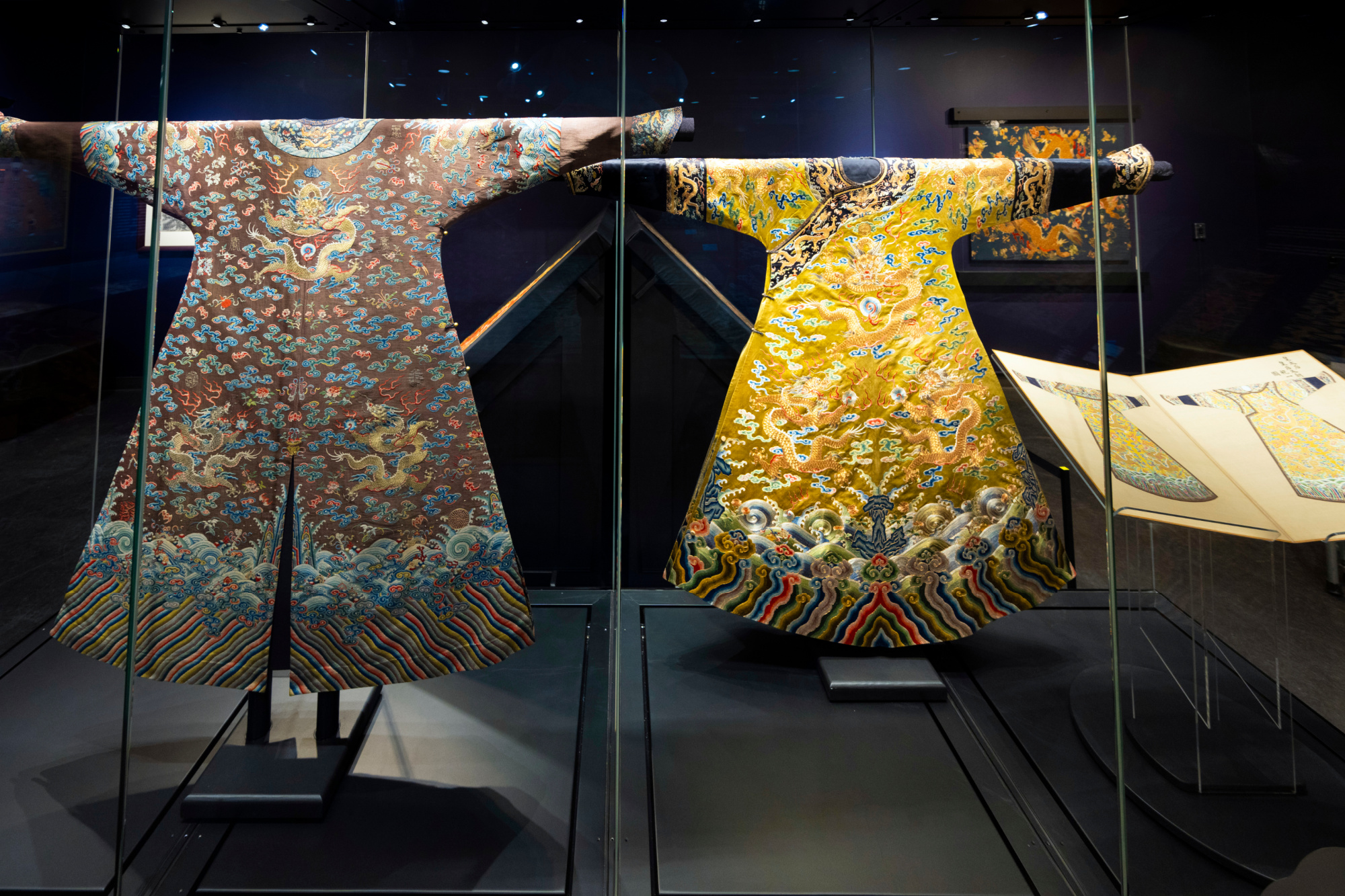 Two dragon robes on display in the Echoes of Thunder exhibition