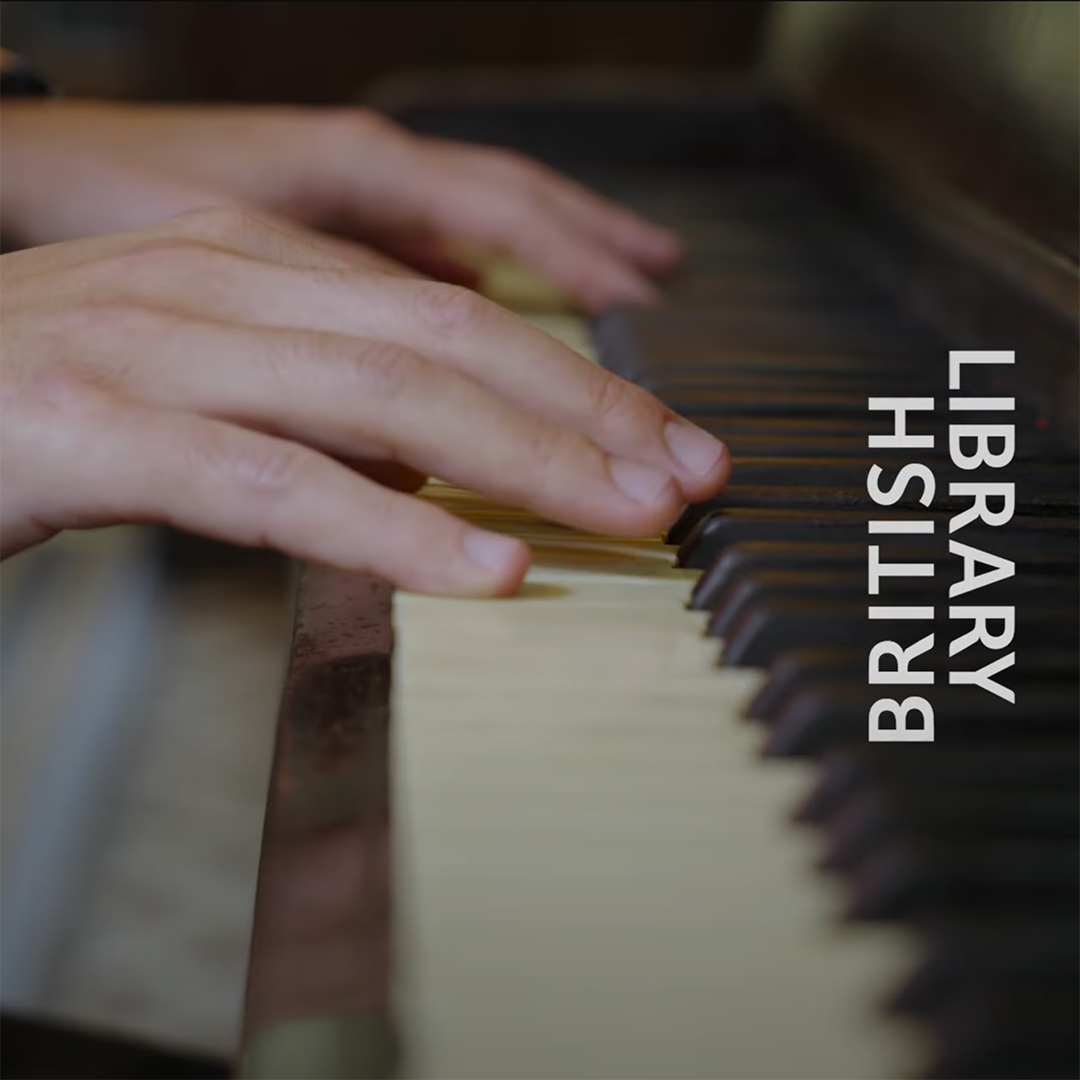 hands on a piano keyboard with the text "British Library" overlayed at the right side of the image