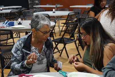 Marilyn Dumont teaches the youth group to bead