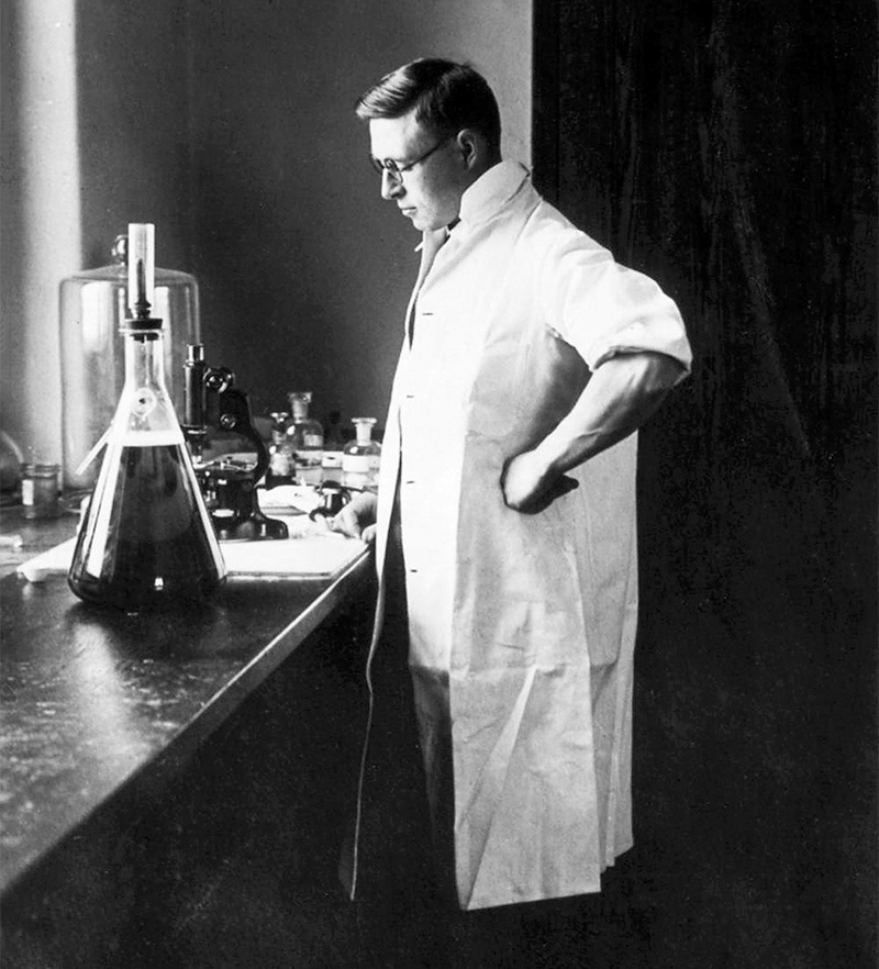 Archival photo of James Collip in his laboratory