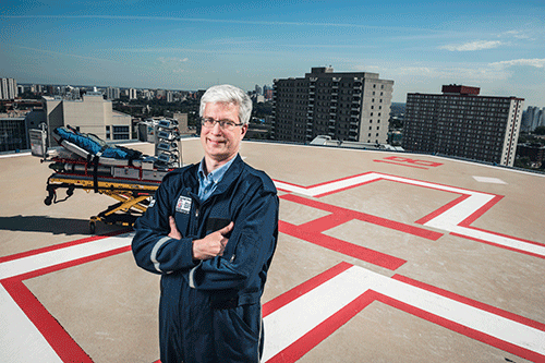 Allan de Caen poses on the helipad in his role as a medical director of the pediatric intensive care transport team at the Stollery Children's Hospital.
