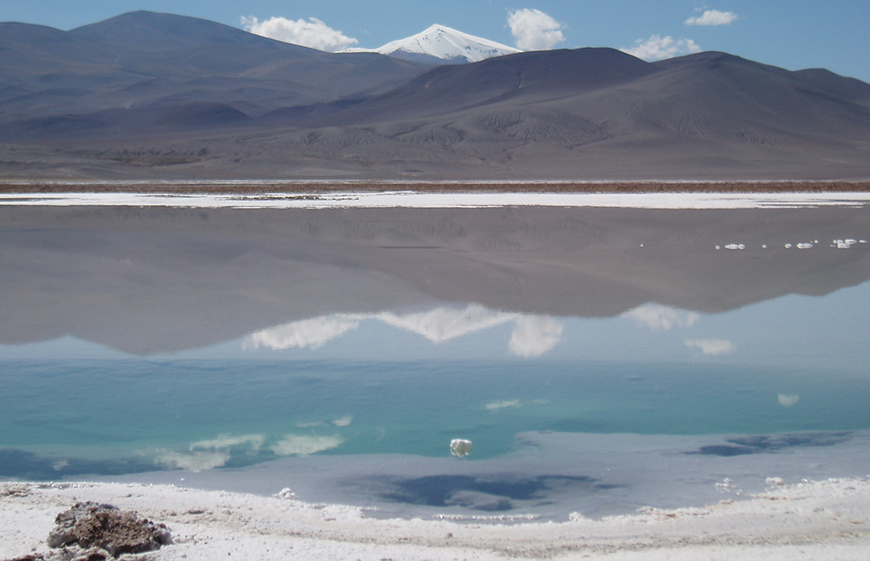A salar (or salt pan) with the Andes mountains in background. The white around the salar is salt; the salt occurs because the evaporation rate is much higher than precipitation rate. We believe that some of the salars are associated with subsidence during lithosphere removal. Photo by Claire Currie.