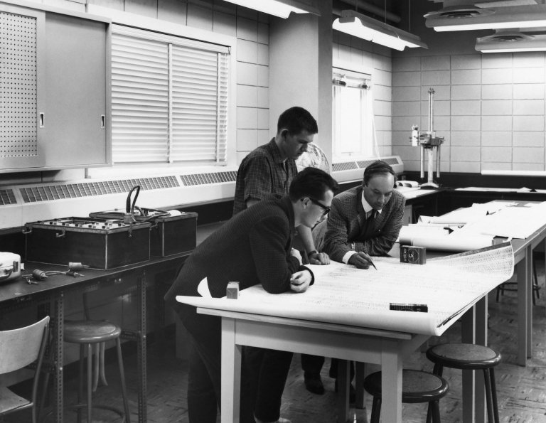 Seismological investigations in 1962. So far we have been unable to identify the people in this picture but the person on the far right could be a young George Garland. Any insights would be appreciated if you happen to recognize the persons. Photo Courtesy: Department of Physics, University of Alberta.