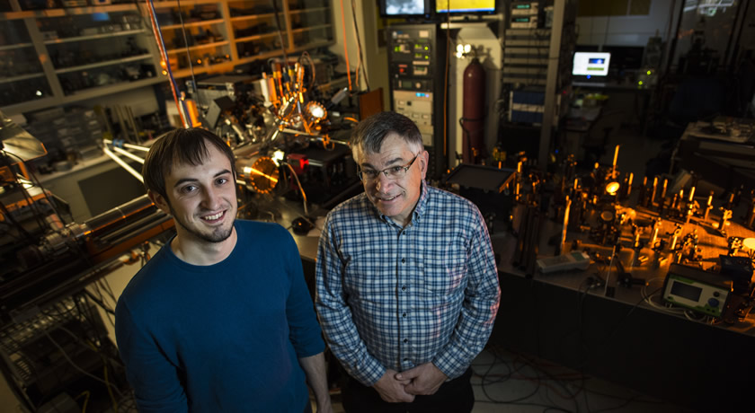 Physics PhD student Vedran Jelic (left) got a jump start on his graduate research when a bonus question on an undergraduate assignment from instructor Frank Marsiglio (right) led him to publishing his first research paper in the European Journal of Physics. (Photo: John Ulan)
