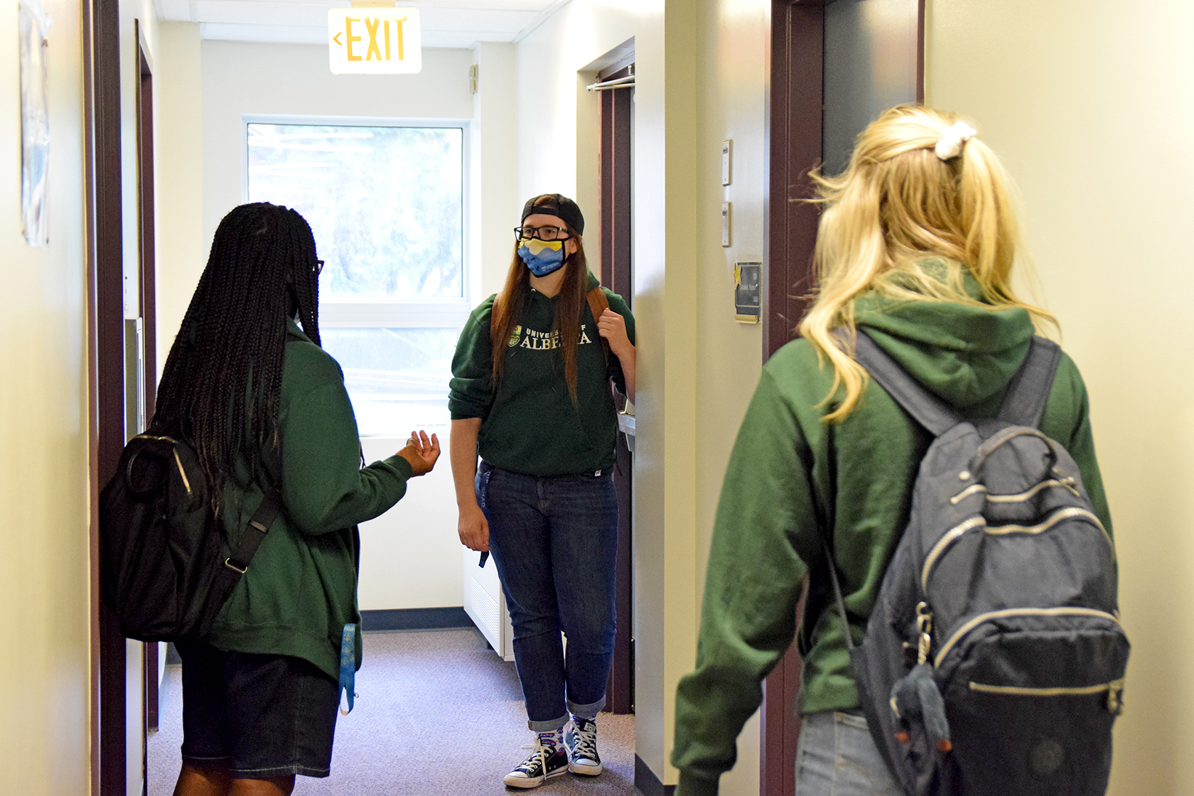 Residents wearing masks in the hall