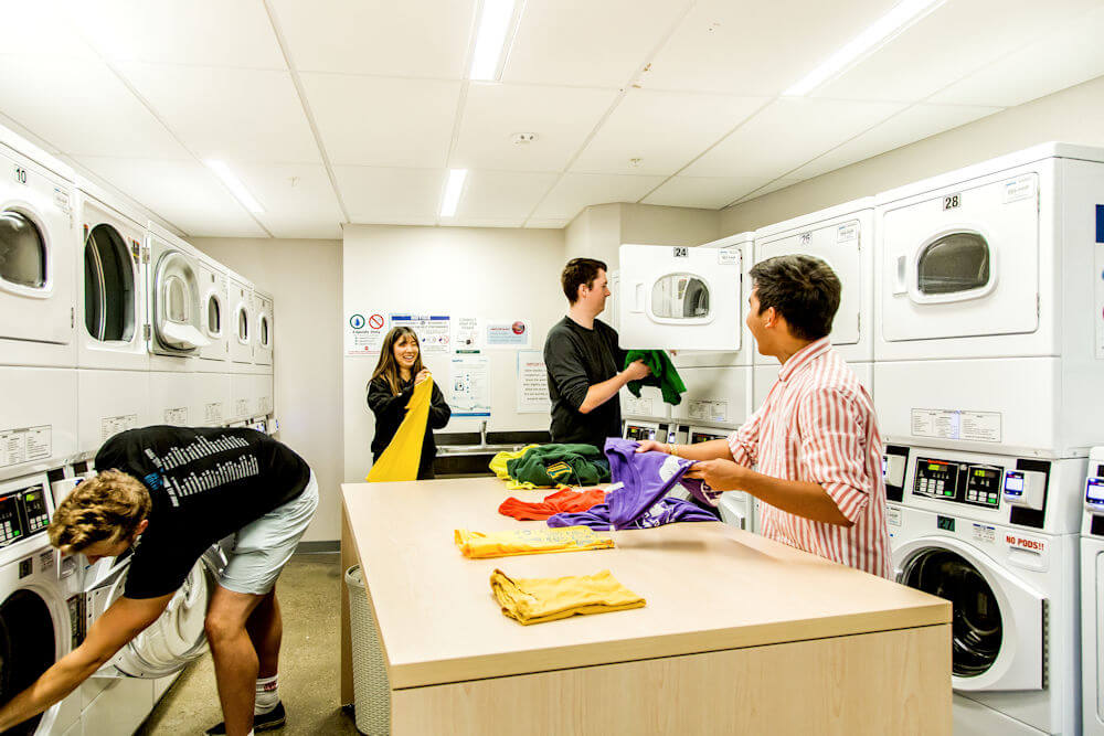Students doing laundry residence