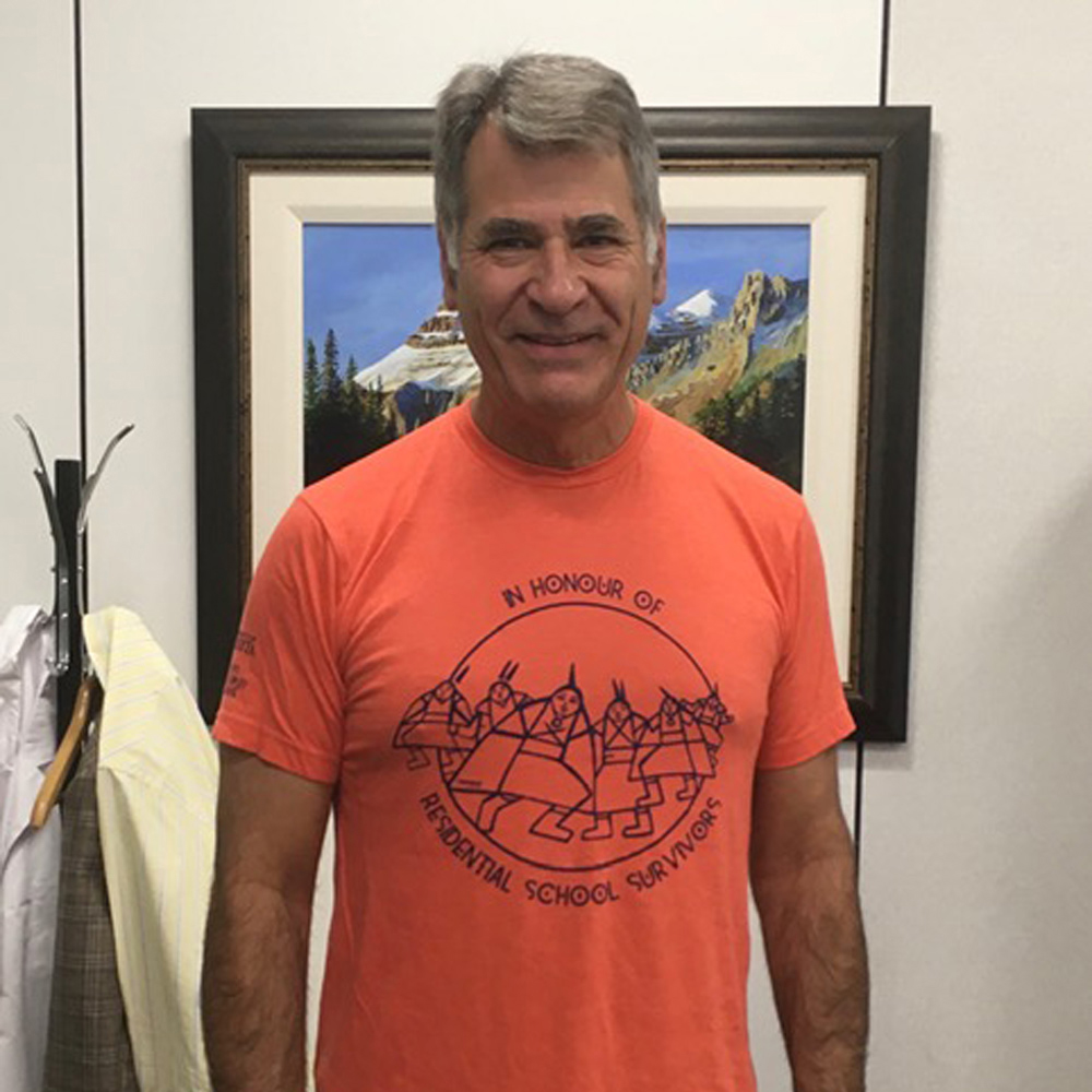 Dr. Paul Major in his orange shirt