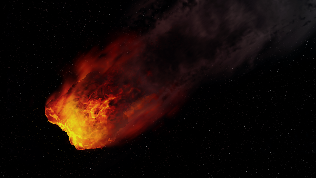 A meteoroid in space igniting with flames as it enters Earth's atmosphere.