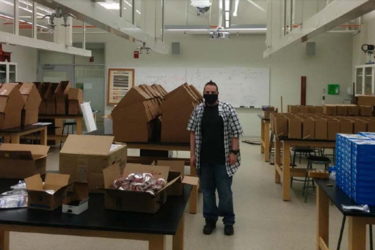 Taylor Rogers packs lab kits to send to undergraduate students.