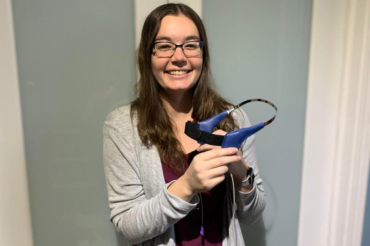 Cassandra Wilkinson, graduate student in the Department of Psychology and project lead on the study, holds one of the prototype headbands.
