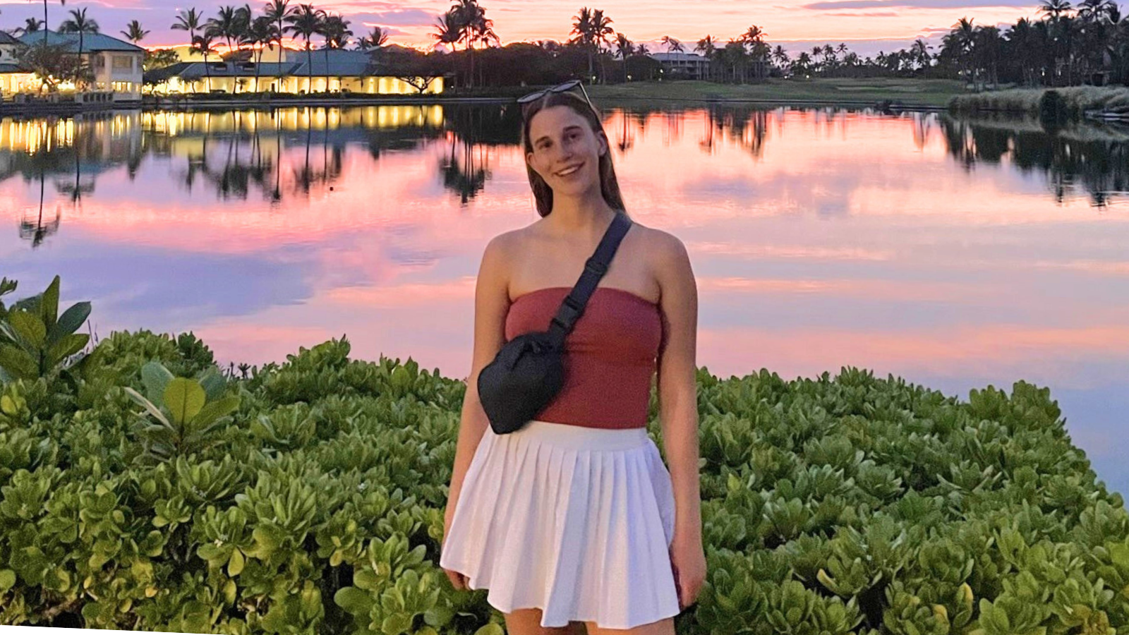 Portrait of Cassidy in front of resort.