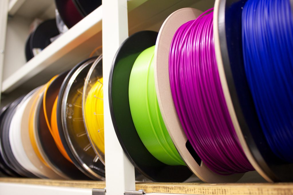Rolls of multicoloured plastic filament for 3D printing
