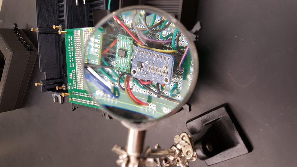 A circuit board through a magnifying glass