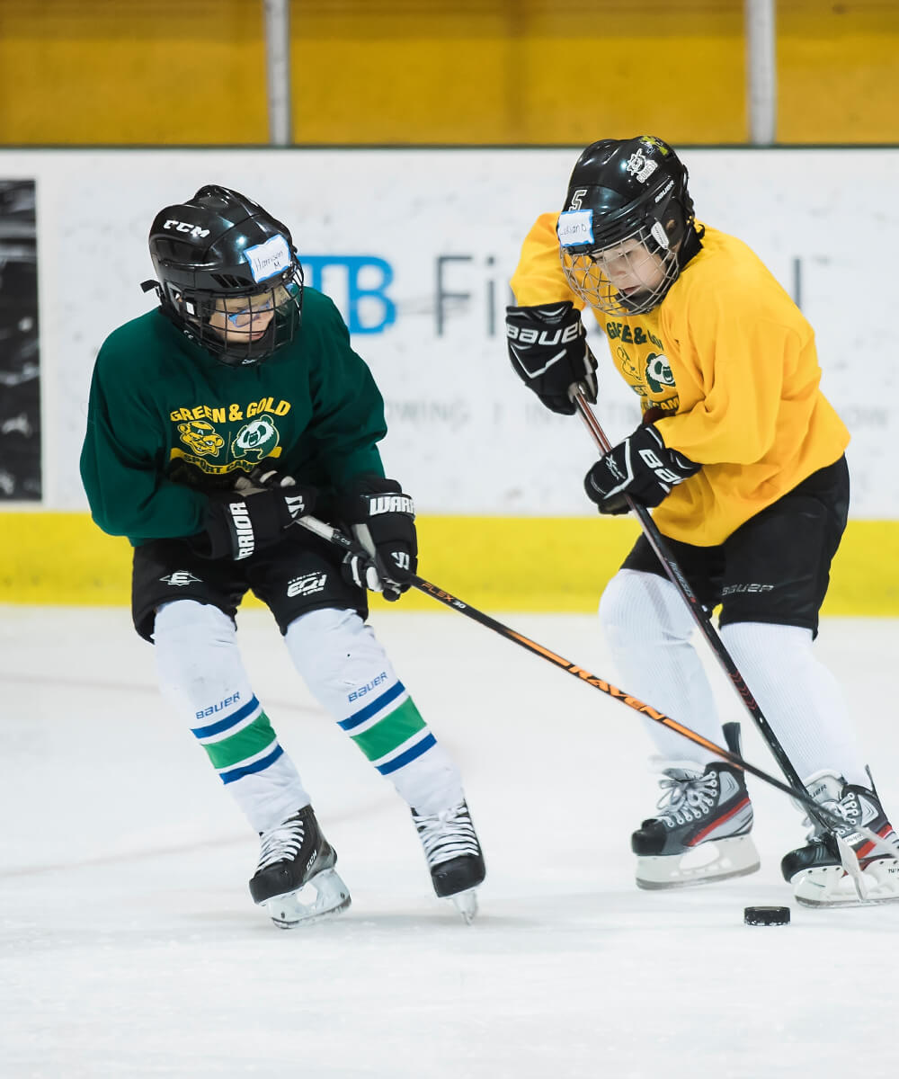 Green & Gold camp participants playing hockey
