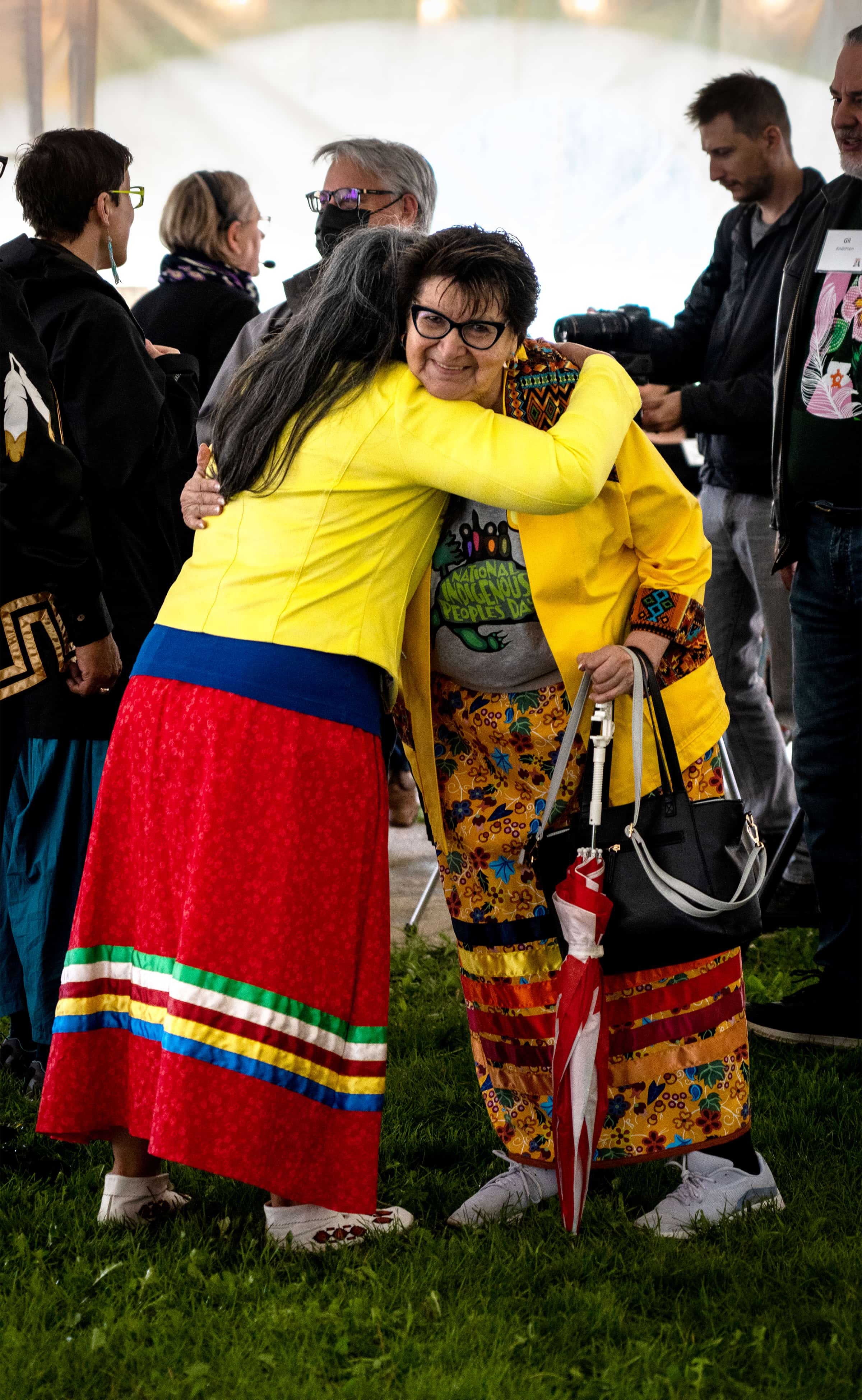 Bev Findlay, administrative assistant in the Faculty of Native Studies, gives Elder Elsey Gauthier a hug before the event.