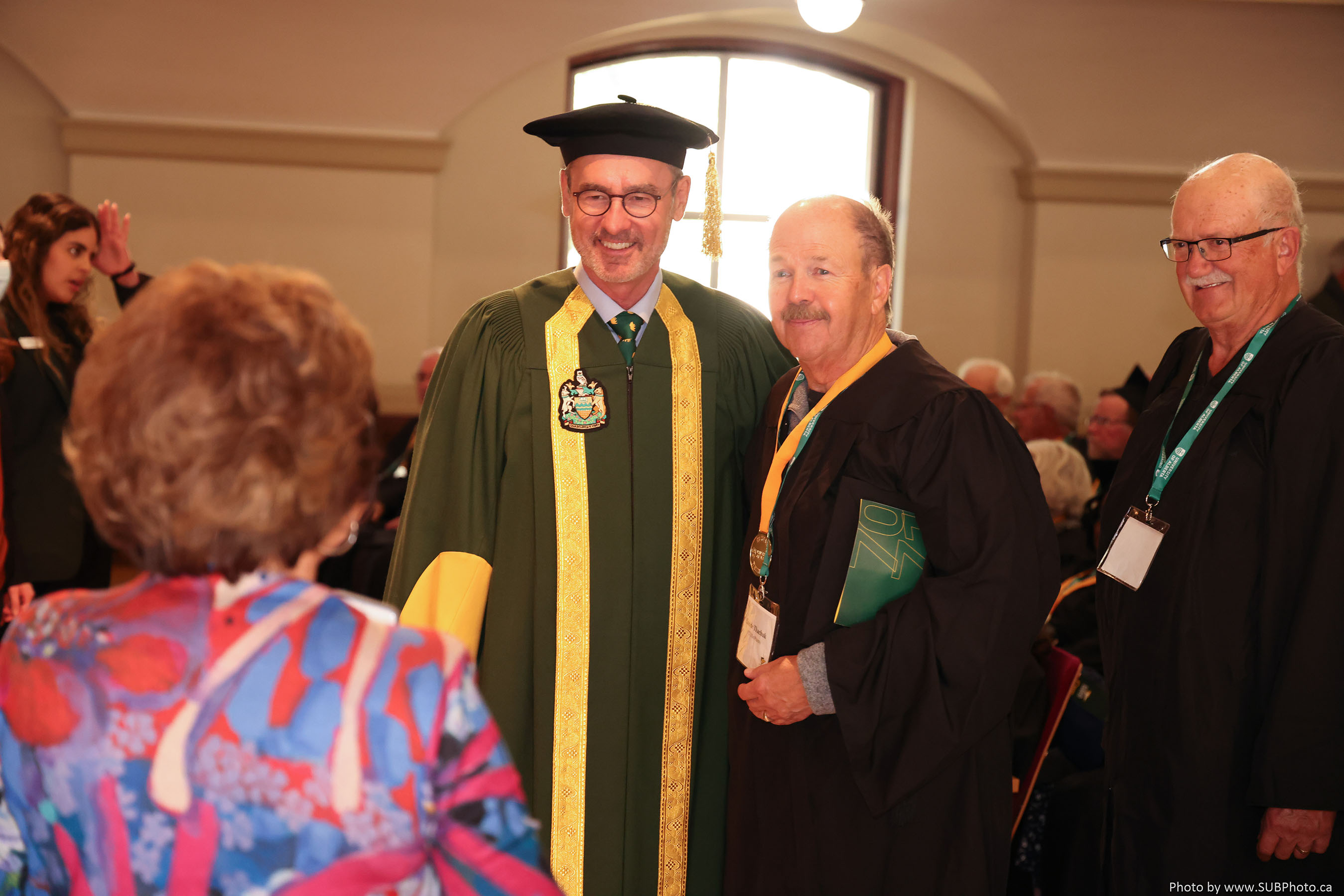 The president poses with an honouree during the Cap ‘n’ Gown ceremony