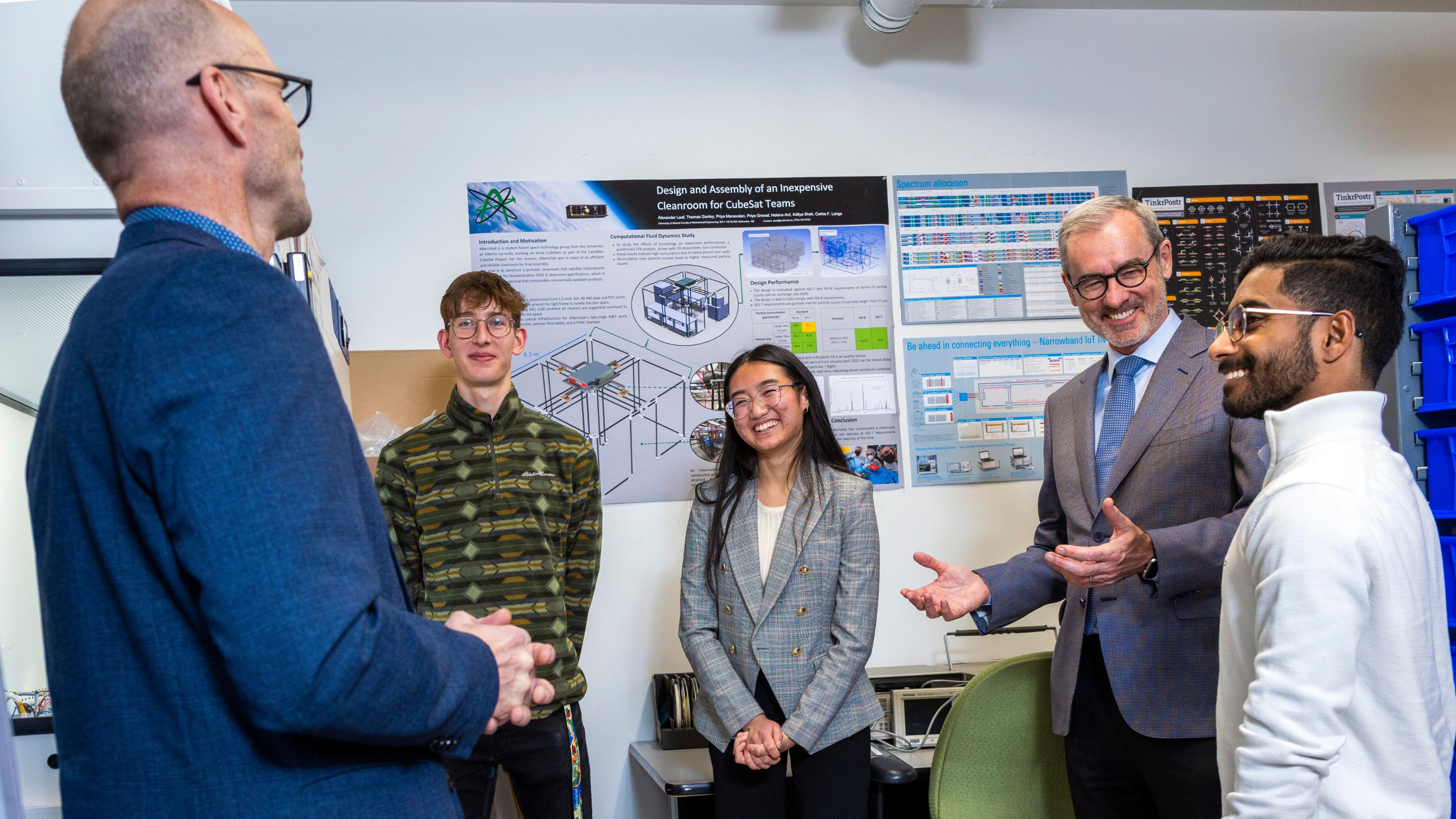 University of Alberta President William Flanagan views 3 satellites that have been built for the Canadian Space Agency's Canadian Cubesat Program, on November 21, 2022. The program involves 15 institutions across Canada — all led by student teams.