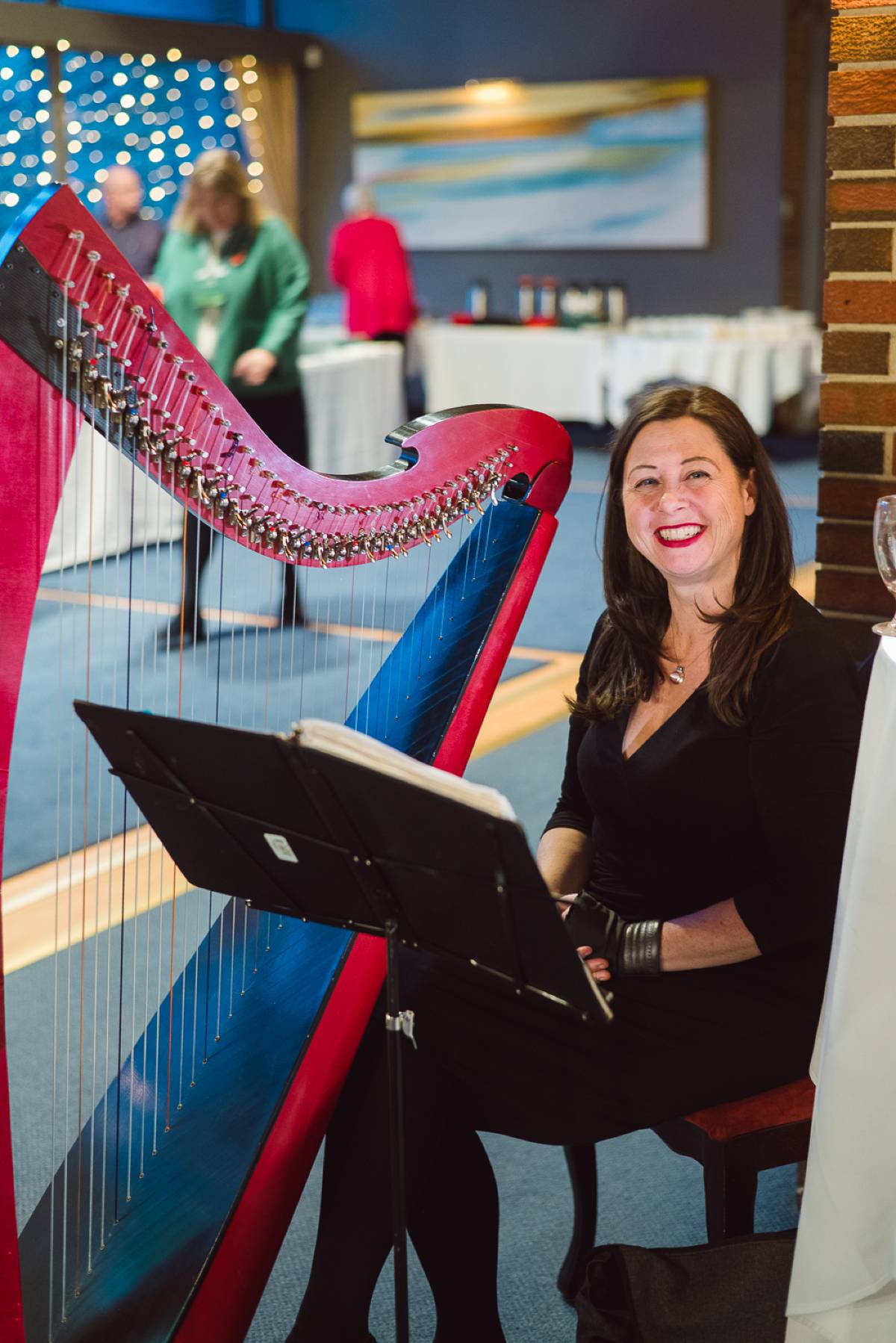 Harpist Keri Lynn Zwicker provides music for the event